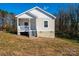 Newly constructed single-story home with a front porch and gray siding at 507 32Nd Sw St, Hickory, NC 28602