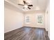 Living room with grey flooring, tray ceiling and two windows at 507 32Nd Sw St, Hickory, NC 28602