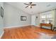 Bright living room with hardwood floors, fireplace, and vaulted ceiling at 2505 Bass Ct, Harrisburg, NC 28075