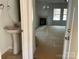 Small powder room with pedestal sink and mirror at 4065 Port Richmond Ave # 15, Gastonia, NC 28056