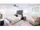 Bright and airy main bedroom with a comfortable seating area at 8946 Glencroft Rd, Mint Hill, NC 28227