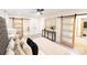 Spacious main bedroom with barn doors to bathroom and large windows at 8946 Glencroft Rd, Mint Hill, NC 28227