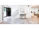 Bright entryway with black door, staircase, and modern console table at 8946 Glencroft Rd, Mint Hill, NC 28227