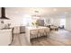 Open kitchen with island, breakfast bar, and stainless steel appliances at 8946 Glencroft Rd, Mint Hill, NC 28227
