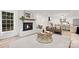Inviting living room with a fireplace, open kitchen view, and ample natural light at 8946 Glencroft Rd, Mint Hill, NC 28227