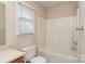 Bathroom with tub, toilet and wooden vanity at 1100 Black Walnut Dr, Hickory, NC 28602