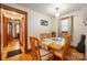 Charming dining area with wood table and view into hallway at 710 Wood St, Statesville, NC 28677