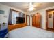 Main bedroom with a king-size bed, dresser, and ceiling fan at 710 Wood St, Statesville, NC 28677