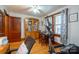 Home office or spare room with desk, elliptical and wood hutch at 710 Wood St, Statesville, NC 28677