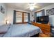 Spacious main bedroom with large bed, TV stand, and ceiling fan at 710 Wood St, Statesville, NC 28677