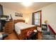 Simple bedroom with a wooden bed frame and exercise equipment at 710 Wood St, Statesville, NC 28677