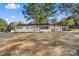 Newly renovated ranch home with a light blue front door and landscaping at 3503 Linwood Rd, Gastonia, NC 28052