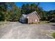 Brick garage with a large driveway, offering ample parking space at 3540 Highway 324 Hwy, Rock Hill, SC 29732