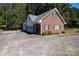 Detached brick garage with three car spaces and large driveway at 3540 Highway 324 Hwy, Rock Hill, SC 29732