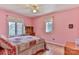 Bedroom with pink walls, hardwood floors, and ceiling fan at 5076 Nc Hwy 127 Hwy, Taylorsville, NC 28681