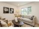 Cozy living room featuring a tufted sofa and coffee table at 9519 Feldbank Dr, Charlotte, NC 28216