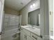 Clean bathroom with a shower/tub combo and vanity at 1712 Mcdonald St, Charlotte, NC 28216