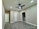 Bright bedroom with hardwood floors and ceiling fan at 1712 Mcdonald St, Charlotte, NC 28216