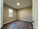 Charming bedroom with a window and wood-look floors at 1712 Mcdonald St, Charlotte, NC 28216