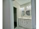 Double vanity bathroom with updated fixtures and large mirrors at 1712 Mcdonald St, Charlotte, NC 28216