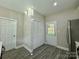 Laundry room with built-in shelving and exterior access at 1712 Mcdonald St, Charlotte, NC 28216