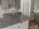 Kitchen with gray cabinets, granite countertops, and an island at 4057 Port Richmond Ave # 13, Gastonia, NC 28056