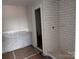 Bathroom with gray vanity, white subway tile shower, and vinyl flooring at 4057 Port Richmond Ave # 13, Gastonia, NC 28056