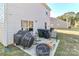 Small backyard patio with seating and fire pit at 140 Tanner Loop, Troutman, NC 28166