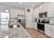 Modern kitchen with stainless steel appliances and granite countertops at 140 Tanner Loop, Troutman, NC 28166