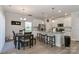 Modern kitchen with white cabinets, granite countertops, and stainless steel appliances at 140 Tanner Loop, Troutman, NC 28166