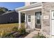 Inviting front porch with rocking chair and landscaping at 140 Tanner Loop, Troutman, NC 28166