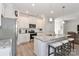 Open concept kitchen with white cabinets, granite countertops and stainless steel appliances at 140 Tanner Loop, Troutman, NC 28166