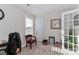 Home office features a window, built-in shelving and french doors at 140 Tanner Loop, Troutman, NC 28166