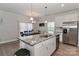 Island kitchen with granite countertop and stainless steel appliances at 140 Tanner Loop, Troutman, NC 28166