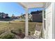 Front porch with rocking chair and neighborhood view at 140 Tanner Loop, Troutman, NC 28166