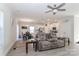 Spacious living room featuring a comfortable grey sectional sofa and an open floor plan at 140 Tanner Loop, Troutman, NC 28166