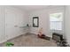 Bedroom with window, closet, and ironing board at 140 Tanner Loop, Troutman, NC 28166