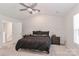 King-size bed in spacious bedroom with ceiling fan at 140 Tanner Loop, Troutman, NC 28166