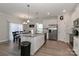 Modern kitchen featuring granite countertops, white cabinetry, and stainless steel appliances at 140 Tanner Loop, Troutman, NC 28166
