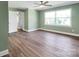 Spacious bedroom with hardwood floors, ceiling fan, and light green walls at 615 E Ridge St, Kings Mountain, NC 28086