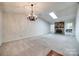 Spacious living room featuring a stone fireplace and skylight at 806 Bridgewood Dr, Rock Hill, SC 29732