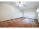 Bright bedroom featuring carpeted floors and a ceiling fan at 806 Bridgewood Dr, Rock Hill, SC 29732