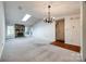 Spacious living room features a stone fireplace and a chandelier at 806 Bridgewood Dr, Rock Hill, SC 29732