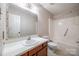 Full bathroom with tub shower and floral wallpaper at 806 Bridgewood Dr, Rock Hill, SC 29732