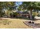 Brick house with a large front yard and landscaping at 4823 Morris Glen Dr, Concord, NC 28027