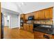 Kitchen with wood cabinets, granite countertops, and stainless steel appliances at 4823 Morris Glen Dr, Concord, NC 28027