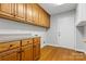 Laundry room with wood cabinets and access to the backyard at 4823 Morris Glen Dr, Concord, NC 28027