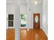 Bright entryway with hardwood floors and a wood front door at 4823 Morris Glen Dr, Concord, NC 28027