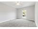 Bedroom featuring a ceiling fan and a window with natural light at 4823 Morris Glen Dr, Concord, NC 28027