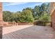Large deck overlooking a wooded backyard at 4823 Morris Glen Dr, Concord, NC 28027